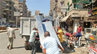 حملة لإزالة الإشغالات بشارع الوحدة في الجيزة | صور