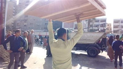 رفع ٢٥٠ حالة إشغال للمحال وسوق الجملة في الجيزة.. صور 