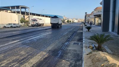 رصف المنطقة المحيطة بالجراج متعدد الطوابق بعرب بورسعيد (صور)