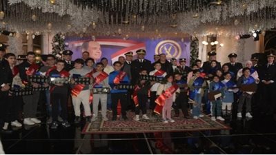 رجال أمن القاهرة يحتفلون مع أسر الشهداء بعيد الشرطة الــ 71