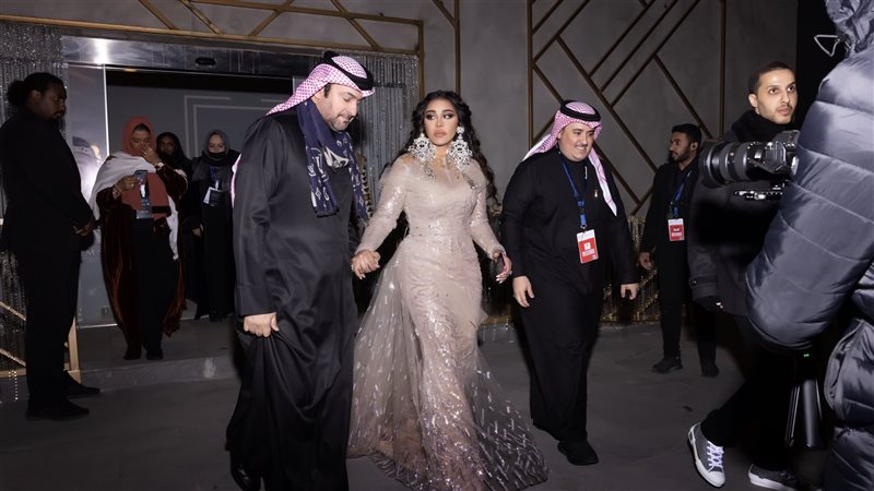 أحلام مع زوجها مبارك