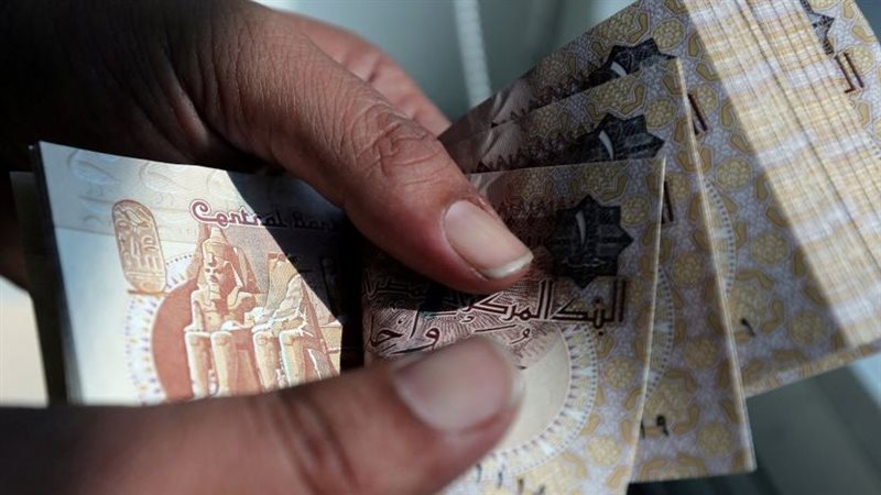  خفض قيمة الجنيه،