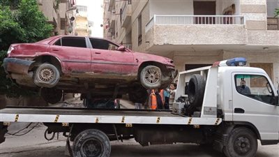 حملة لرفع السيارات المتروكة والمخالفة بالدقي