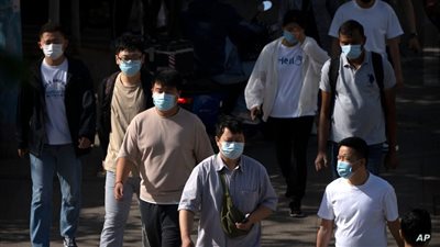 توقعات بذروة موجة جديدة من كورونا في الصين