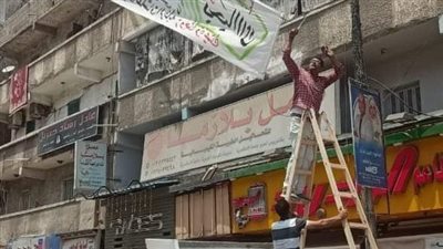 حي العجمي يزيل لافتة لزوجة تصالح زوجها بسبب خروجها على القيم (صور)