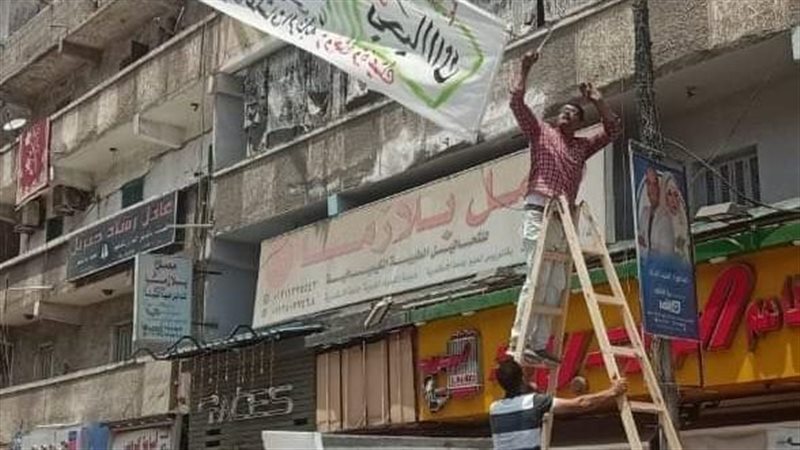 حي العجمي يزيل لافته