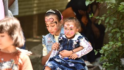الرسم على الوجوه يجذب زوار حديقة الحيوان في رابع أيام عيد الأضحى (صور)
