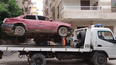 حملة لرفع السيارات المخالفة للانتظار ببولاق الدكرور