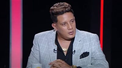 تفاصيل معركة حمو بيكا مع صاحب محل واقتياده بالكلبش لقسم العامرية 