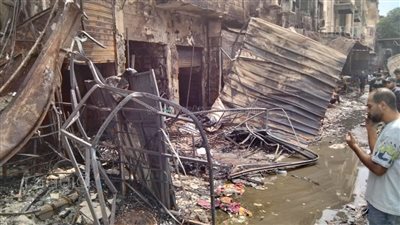 آثار حريق السوق التجاري بالسيدة زينب وشاهد عيان: صحينا لقينا المحلات اتحرقت (فيديو)