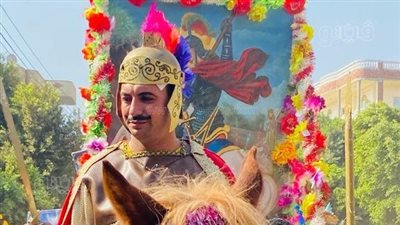 أعلام وخيول وزفة شعبية.. الاحتفال بأول كنيسة لـ مار جرجس في المنيا يجمع المسلمين والأقباط.. والتسابيح والألحان تتصدران المشهد (فيديو وصور) 
