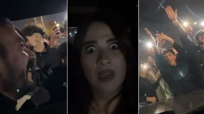  شاهد ماذا فعل الجمهور مع العوضي وياسمين عبد العزيز بعد مرور سيارتهما بأحد الشوارع (فيديو)
