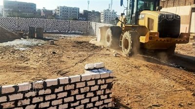 حملة لإزالة التعديات ورفع الإشغالات وتنفيذ أعمال الصيانة لشبكات الكهرباء بمدن أسوان (صور)