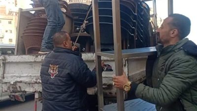 غلق وتشميع محل مقام بالمخالفة في منور عقار بالعجوزة (صور)