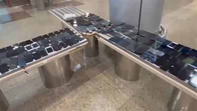 ضبط 1000 شاشة تليفون و562 رخصة سيارة بحوزة راكبين في مطار القاهرة (صور)