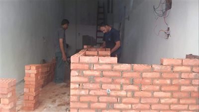 حملة مكثفة لحي العمرانية لإزالة مخالفات البناء (صور)