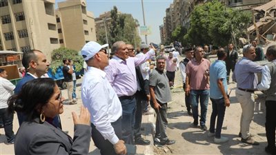 استخراج ناجية من تحت أنقاض عقار أرض الجولف المنهار (صور)