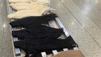الشعر المستعار والمخدرات والهواتف، قائمة بأكثر محاولات التهريب بمطار القاهرة (صور)
