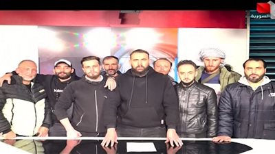 فصائل المعارضة تبث أول بيان لها إلى الشعب السوري على شاشة التلفزيون الرسمي