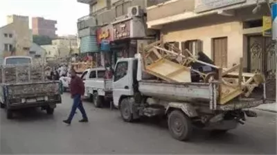 إغلاق محل لبيع بطاريات مجهولة ورفع الإشغالات بالعجوزة وإمبابة