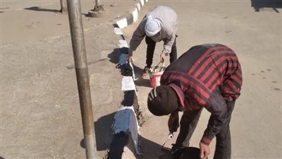 استمرار أعمال التطوير والتجميل بموقف المعلمين بحي غرب أسيوط