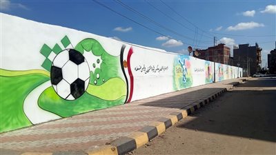 طلاء الأسوار لتحسين الصورة الجمالية بشوارع أجا في الدقهلية 