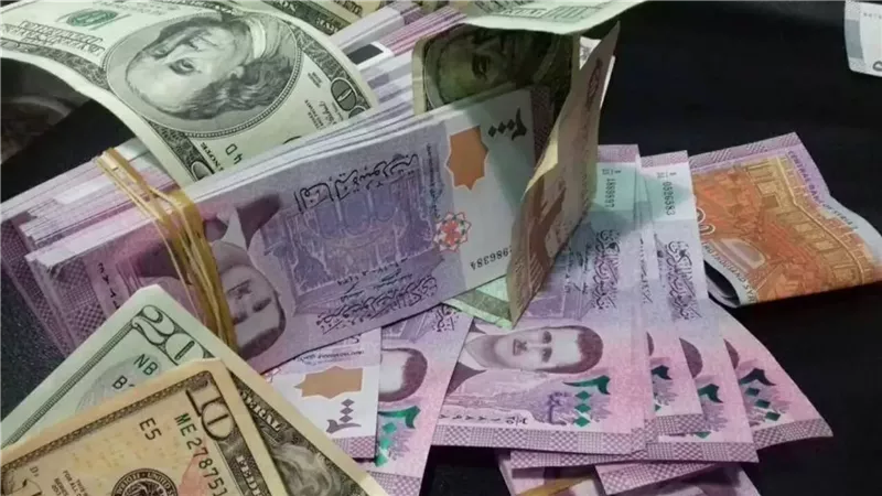 الليرة السورية والدولار،
