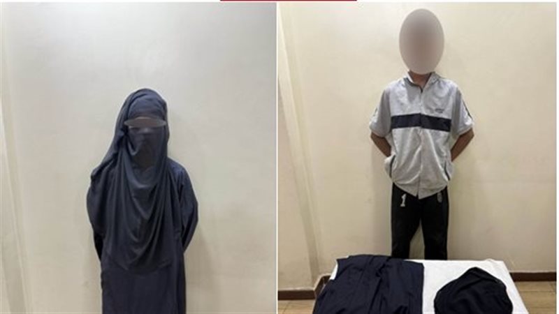 ضبط طالب يرتدى نقاب،