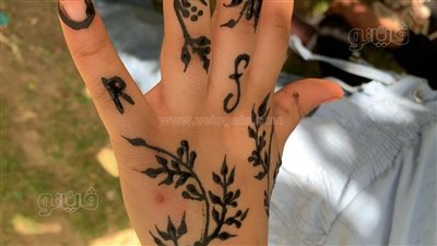 رسم الحنة الأبرز، مظاهر الاحتفال بشم النسيم بجنينة الأسماك بالزمالك (فيديو وصور) 