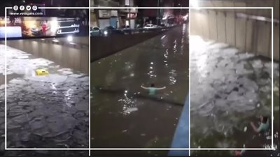 شاب يعرض حياته للخطر ويبحث عن توك توك داخل نفق أغرقته مياه الأمطار في الإسكندرية (فيديو)