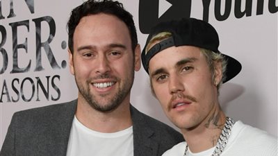 جاستن بيبر يسوي خلافاته مع سكوتر براون بـ 31.5 مليون دولار