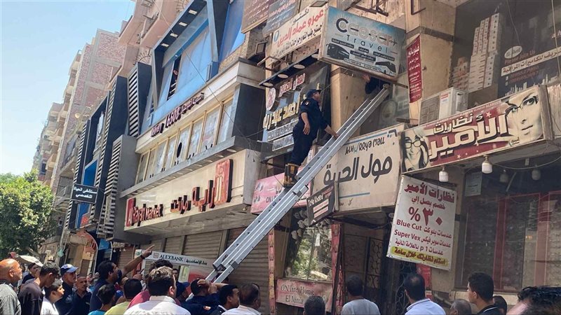 حريق محل في برج سكني