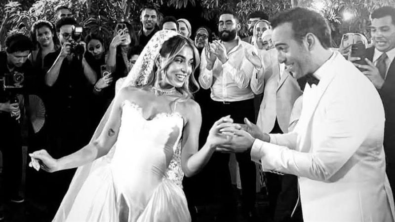 هاجر السراج وزوجها.