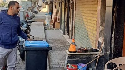 شمال الجيزة ينبه بوضع صناديق قمامة أمام المحلات التجارية 