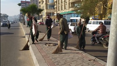 حملة نظافة بمواقف السيارات بشارع المدبح في الجيزة | صور