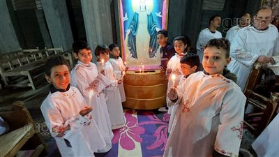 قداس عيد الغطاس بكنيسة رئيس الملائكة ميخائيل بقرية المطاعنة بإسنا | صور