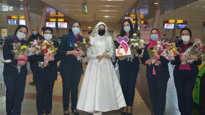 مطار القاهرة الدولي يحتفل باليوم العالمي للمرأة| صور