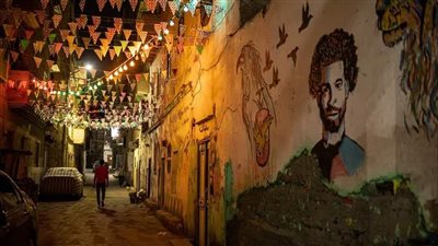 قرى قوص تتزين برسومات محمد صلاح والأنوار ابتهاجا بشهر رمضان | صور