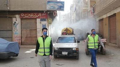 بعد ظهور حالة كورونا.. تطهير شارع المتاجر ببلبيس في الشرقية | صور