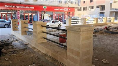 أعمال تطوير موقف السرفيس أسفل محور الفريق كمال عامر بالجيزة | صور