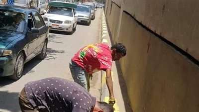 رفع الأتربة واستكمال أعمال دهان البلدورات أسفل محور الفريق كمال عامر|صور