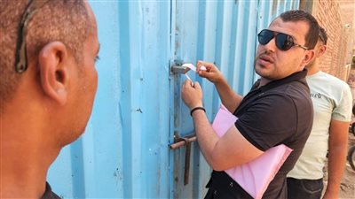 تشميع وإغلاق مغسلة وورشة لتغيير الزيوت بدون ترخيص بالجيزة | صور