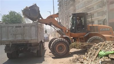 رفع القمامة والسيارات المتهالكة من شوارع الوراق