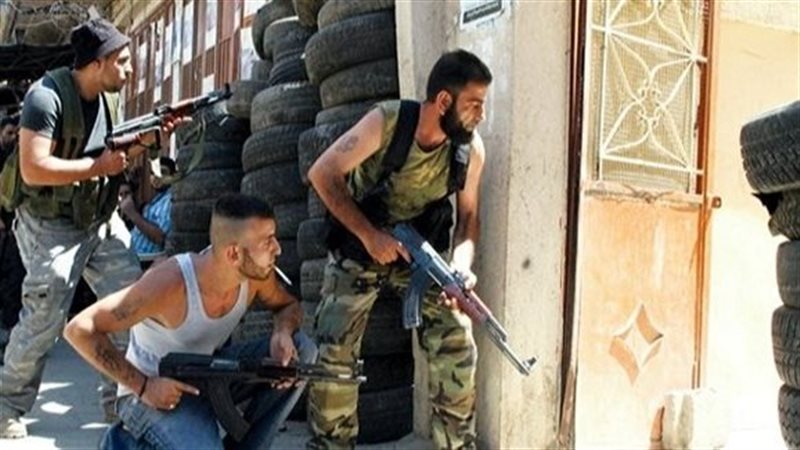 مسلحين بمخيم عين