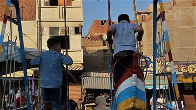 الملاهي الشعبية تجذب الأطفال في ممشى المنصورية ثاني أيام عيد الأضحى|صور 