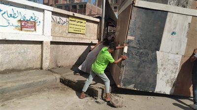 إزالة كشك مقام بالطريق العام في مركز أوسيم | صور