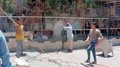 الجيزة تزيل مقاهي بميدان الكيت كات لرصف طريق العجوزة | صور