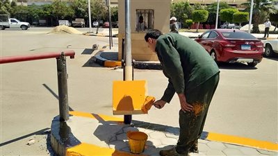 رفع المخلفات ودهان الأسوار بسوق الجملة بالسادس من أكتوبر | صور