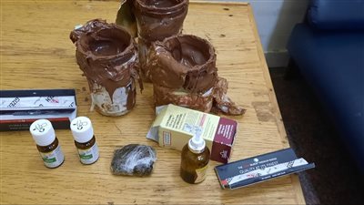 حشيش بالشيكولاته.. إحباط تهريب مخدرات داخل نوتيلا بمطار القاهرة 