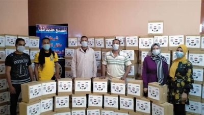 500 كرتونة غذائية للأسر الأكثر احتياجًا في قنا | صور